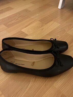 Black ballet flats with bow detail, worn a couple...